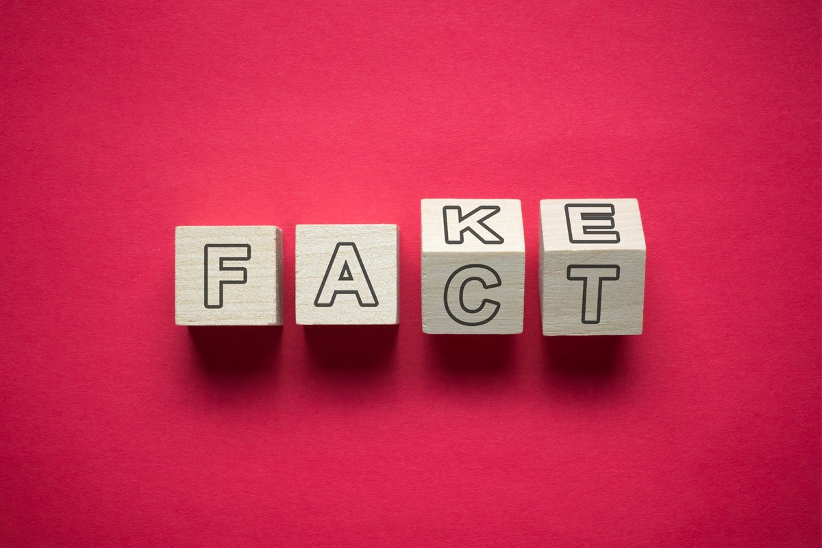 Four wooden blocks spelling the word FACT on a red background. | Forensic Discovery