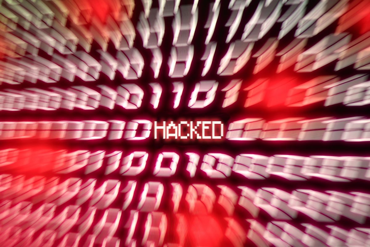 Blurred image of binary code with the word HACKED in the center. | Forensic Discovery